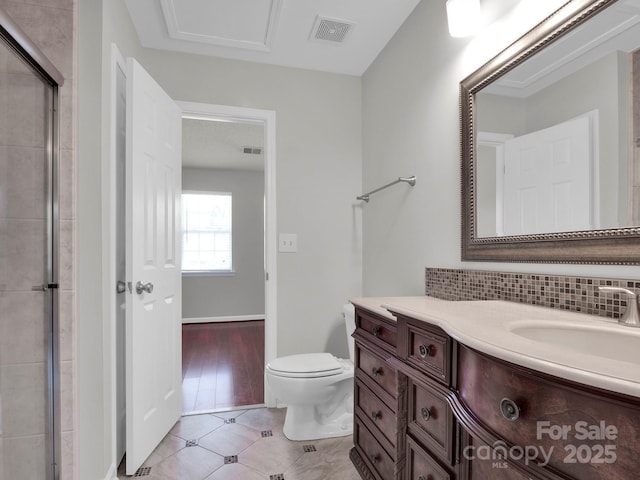 bathroom featuring tasteful backsplash, visible vents, toilet, tile patterned floors, and vanity