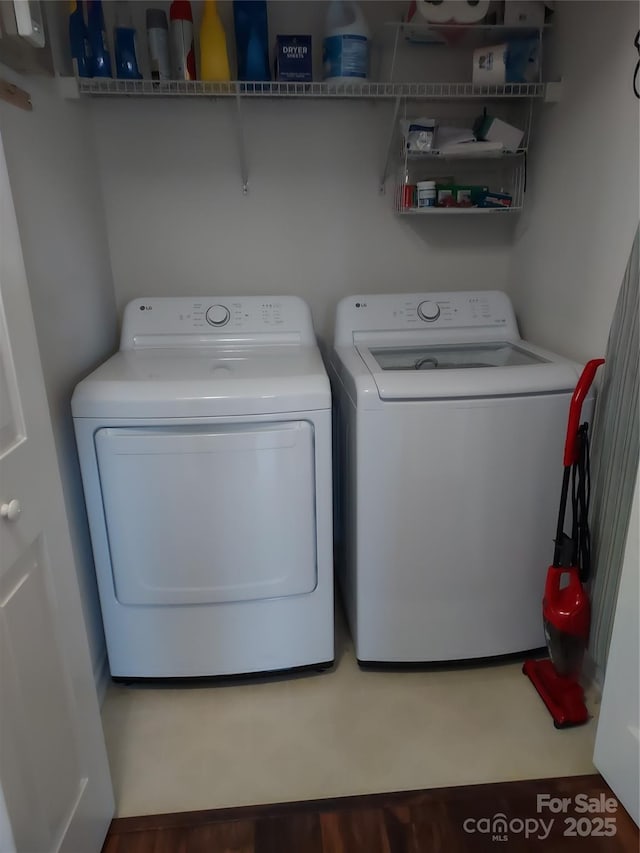 clothes washing area featuring laundry area and independent washer and dryer