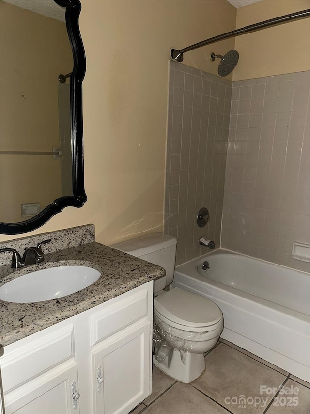 full bathroom featuring shower / tub combination, vanity, toilet, and tile patterned floors