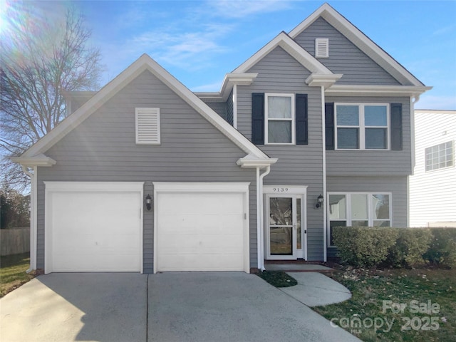 view of front of property featuring a garage and driveway