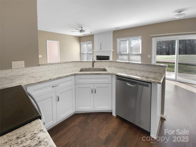 kitchen featuring a sink, dark wood-style floors, white cabinets, and dishwasher