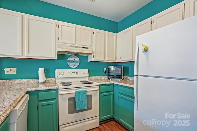 kitchen featuring white appliances, white cabinets, dark wood-style floors, light countertops, and under cabinet range hood