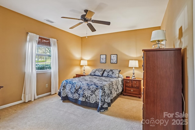 bedroom with baseboards, visible vents, ceiling fan, and carpet flooring