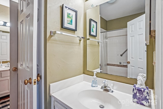 bathroom with a shower with curtain and vanity