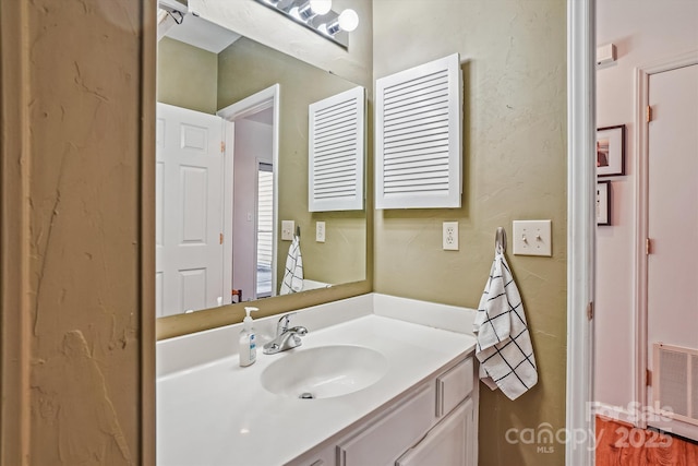 bathroom featuring visible vents and vanity