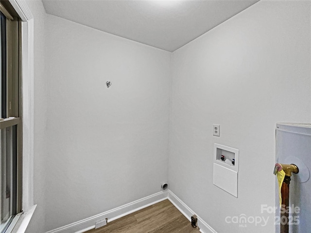 laundry area featuring dark wood-type flooring, washer hookup, laundry area, and baseboards