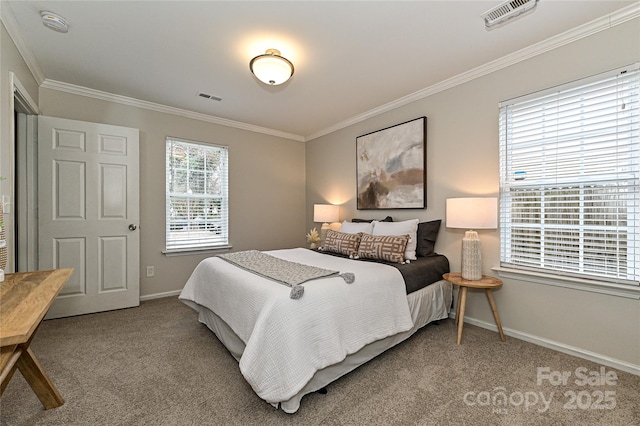 carpeted bedroom with visible vents, baseboards, and ornamental molding