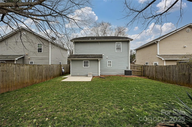 back of house with a patio area, cooling unit, a lawn, and a fenced backyard