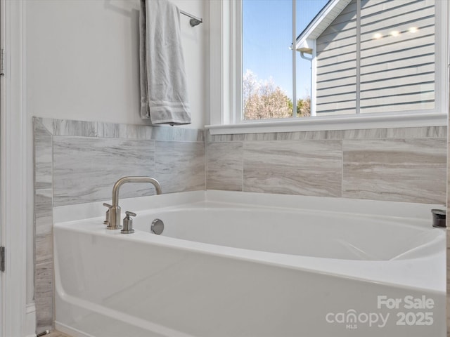 bathroom with a garden tub