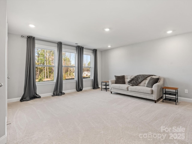 living room with carpet flooring, recessed lighting, and baseboards