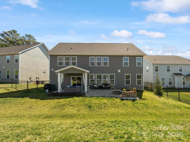 back of house featuring a fenced backyard, a patio, and a yard