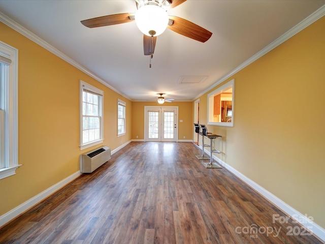 unfurnished living room featuring crown molding, baseboards, an AC wall unit, french doors, and dark wood-style floors