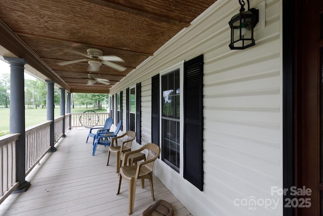 deck with a porch and a ceiling fan