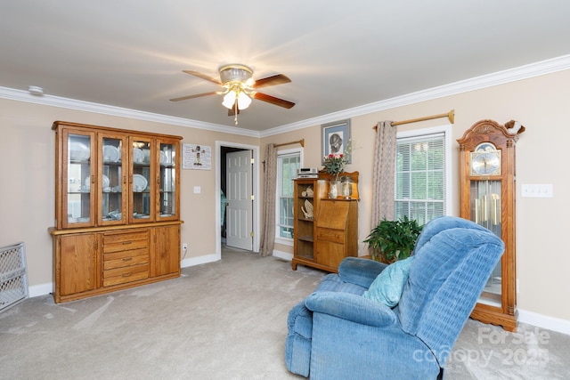 sitting room featuring baseboards, ornamental molding, and light colored carpet