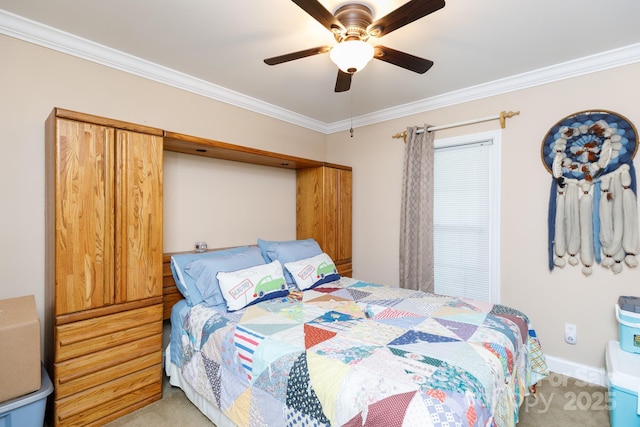 carpeted bedroom featuring a ceiling fan and crown molding