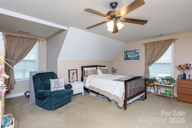 carpeted bedroom with lofted ceiling, visible vents, ceiling fan, and baseboards