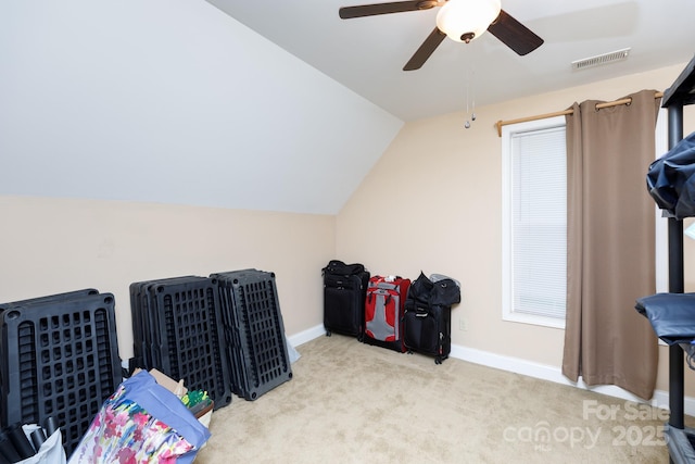 playroom with ceiling fan, visible vents, baseboards, vaulted ceiling, and carpet