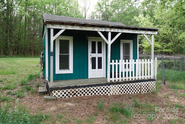 view of outdoor structure with an outdoor structure and fence