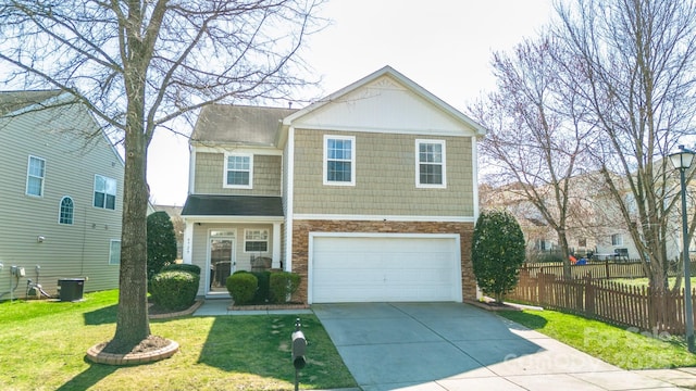 view of front of home with central air condition unit, an attached garage, fence, driveway, and a front lawn