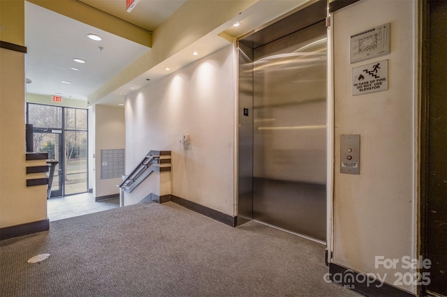 hallway featuring recessed lighting, baseboards, and carpet floors