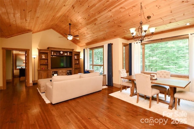 living room with lofted ceiling, a wealth of natural light, and wood finished floors