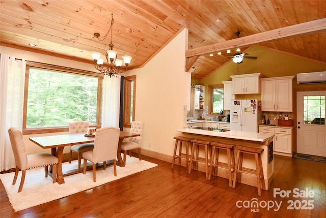 dining space with lofted ceiling with beams, a wall mounted AC, dark wood finished floors, and wood ceiling