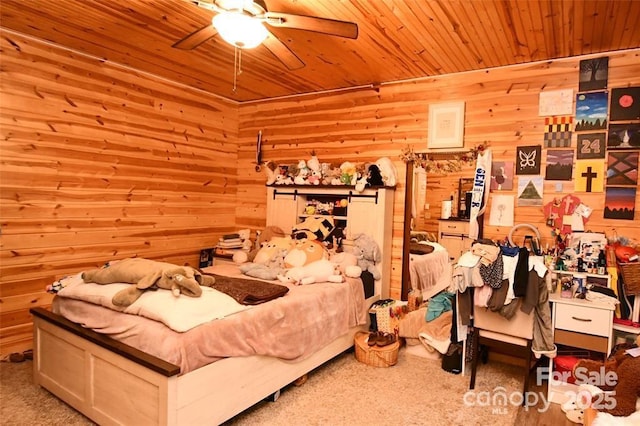 bedroom featuring a ceiling fan, wood ceiling, carpet flooring, and wooden walls