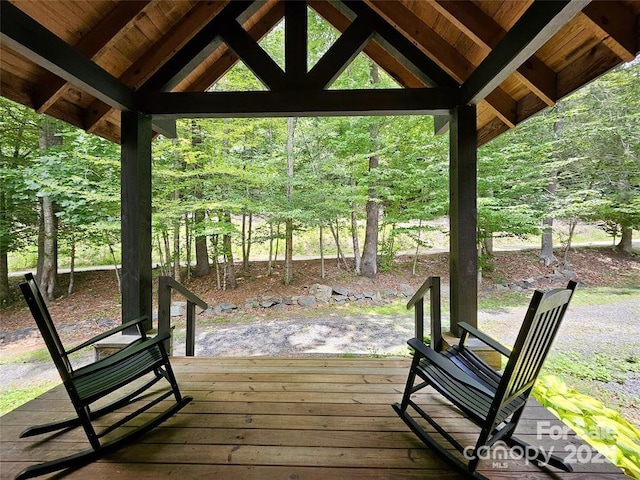 wooden terrace featuring a gazebo