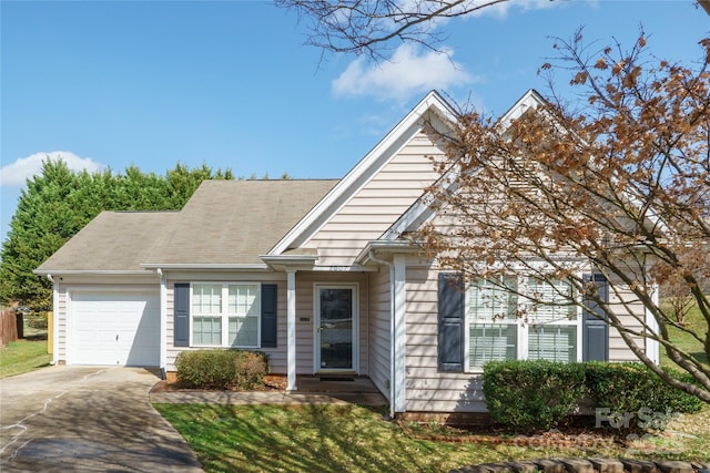 view of front of house with a garage and concrete driveway