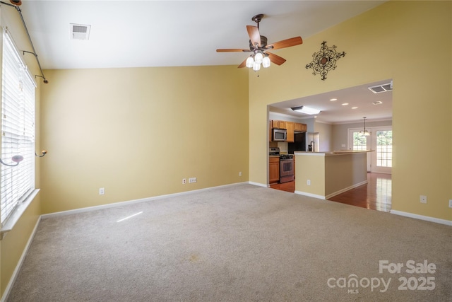 unfurnished living room featuring visible vents, baseboards, ceiling fan with notable chandelier, carpet floors, and recessed lighting