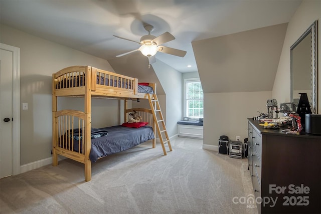 carpeted bedroom with vaulted ceiling, recessed lighting, a ceiling fan, and baseboards