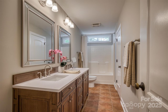 bathroom with shower / washtub combination, double vanity, visible vents, toilet, and a sink