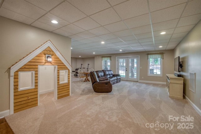 unfurnished living room featuring carpet, french doors, recessed lighting, visible vents, and baseboards