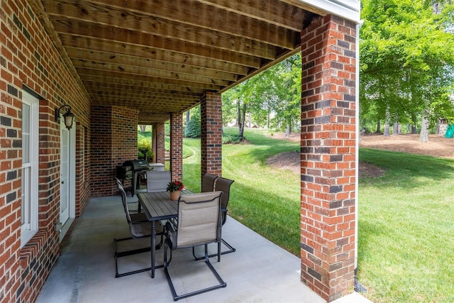 view of patio featuring outdoor dining area and grilling area