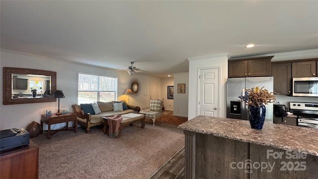 living area with ceiling fan, ornamental molding, carpet flooring, and recessed lighting