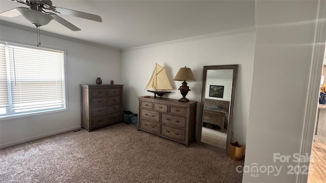 bedroom with ceiling fan, carpet floors, and ornamental molding