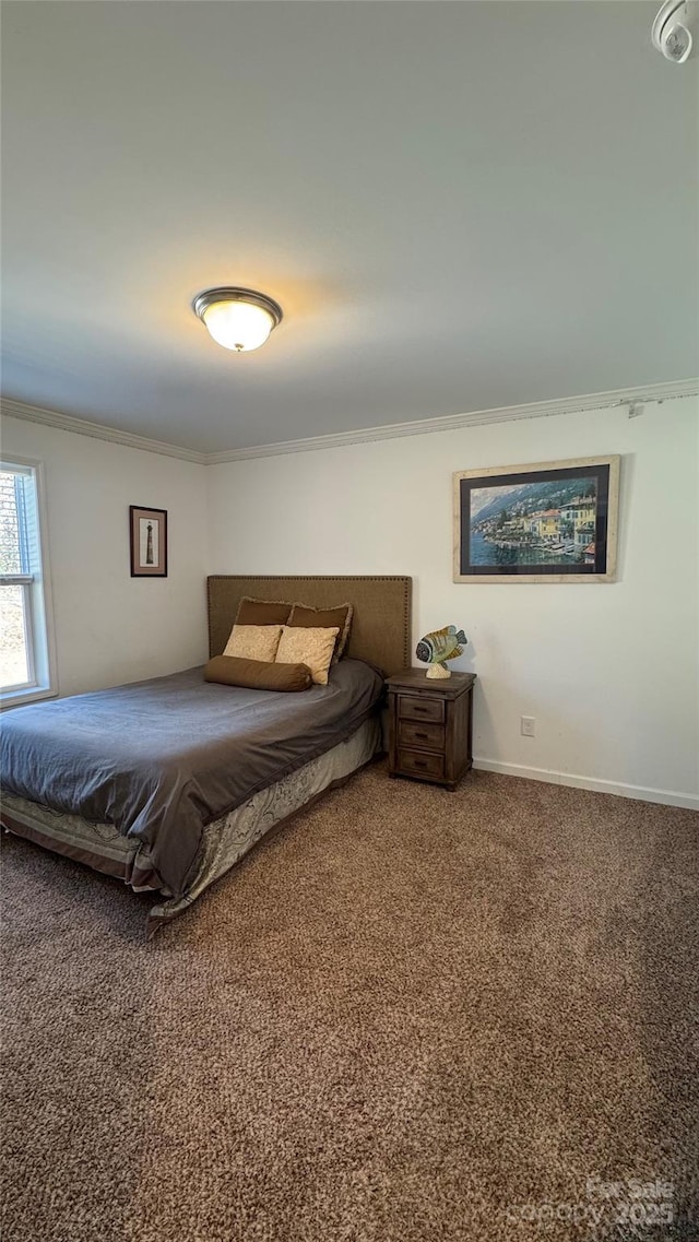 bedroom featuring carpet floors, crown molding, and baseboards