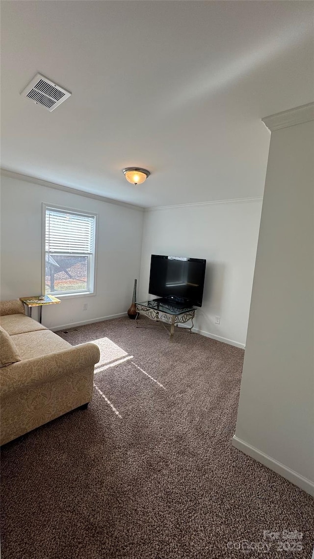 carpeted living area with visible vents and baseboards