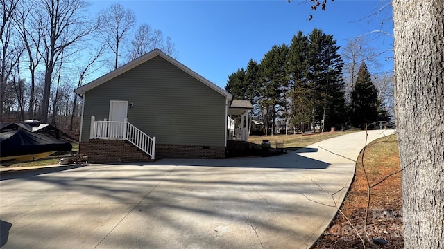 view of side of property featuring crawl space