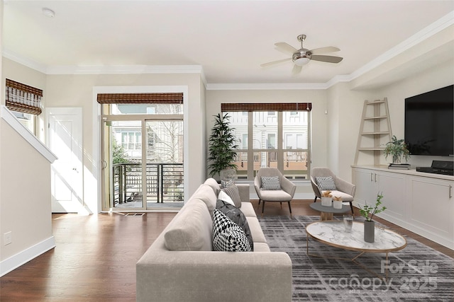 living area featuring dark wood-type flooring, built in features, ceiling fan, baseboards, and crown molding