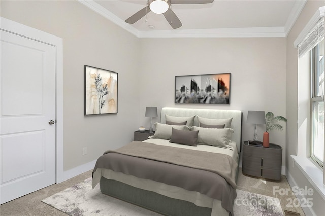 carpeted bedroom with ornamental molding, ceiling fan, and baseboards