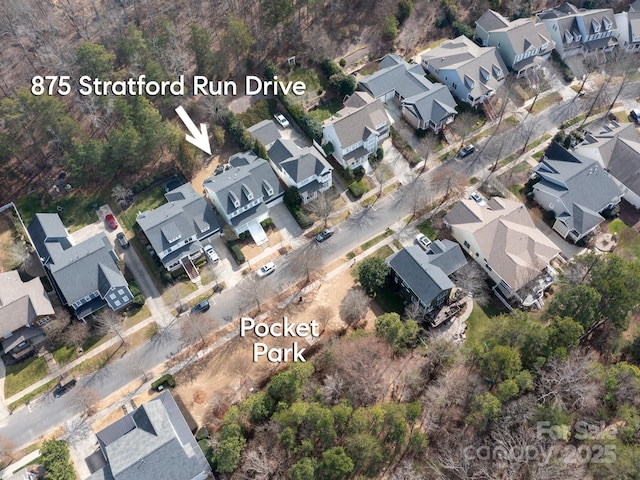 birds eye view of property with a residential view