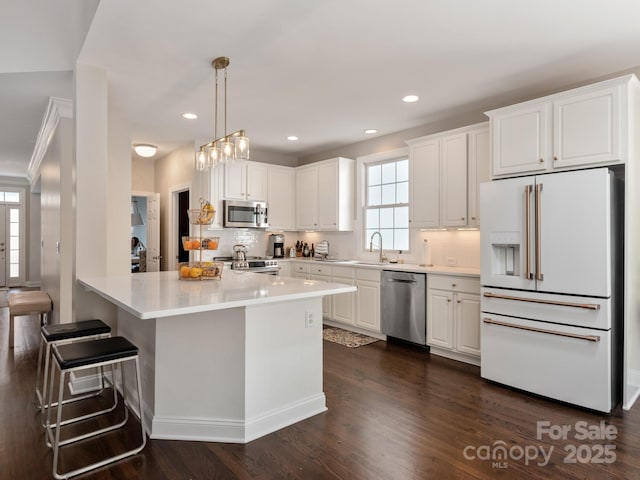 kitchen featuring backsplash, white cabinetry, stainless steel appliances, and light countertops