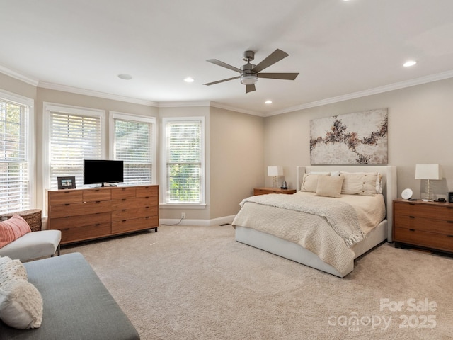 carpeted bedroom with recessed lighting, a ceiling fan, baseboards, and ornamental molding