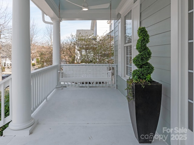 balcony featuring covered porch and ceiling fan