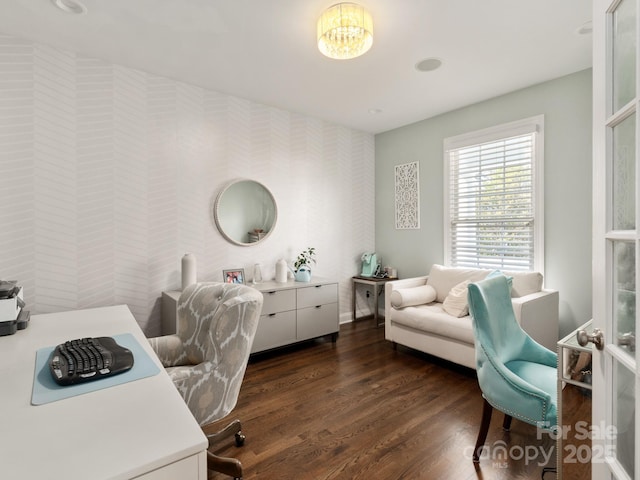 home office with wallpapered walls, baseboards, an accent wall, and dark wood finished floors