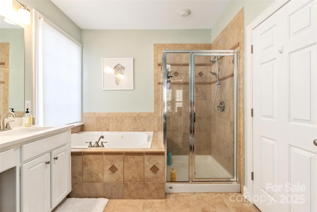 bathroom with tile patterned floors, a garden tub, vanity, and a shower stall