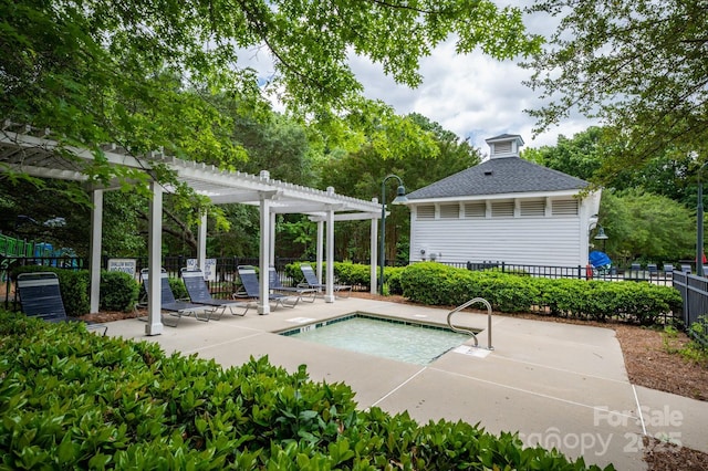 view of pool with a pergola, fence, a patio, and a swimming pool