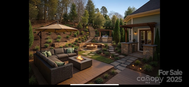 exterior space with stairway and an outdoor living space with a fire pit