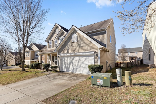 view of front of property with a garage, a residential view, and concrete driveway